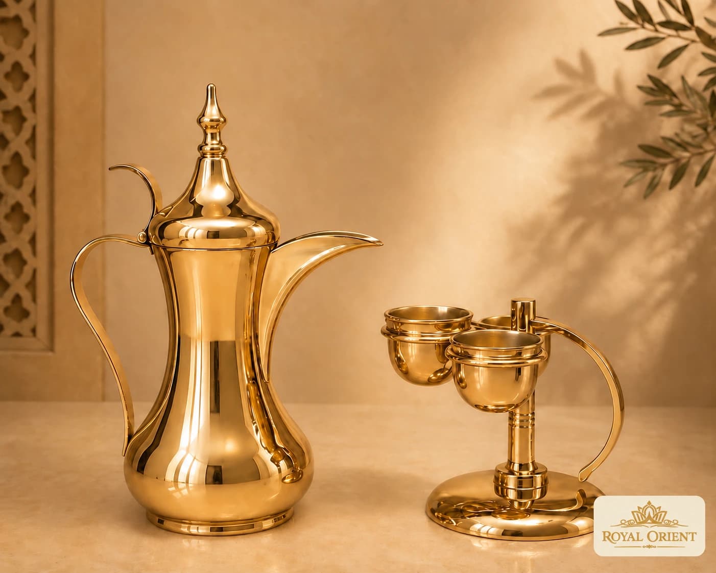 Gold dallah coffee pot with two matching cups