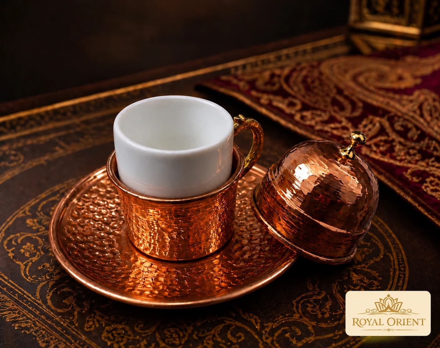 Copper coffee cup with a white insert, matching lid and saucer